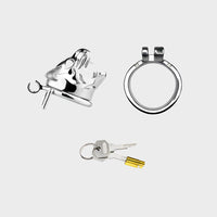A locking chastity cage sits in parts on a grey background. This is preferred by submissive men in power exchange relationships.