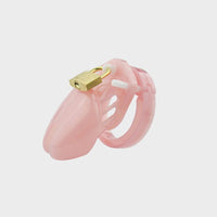 A small pink chastity cage for sissies