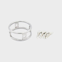 A tight steel cock ring from Chastity Cages Co with sharp screws.