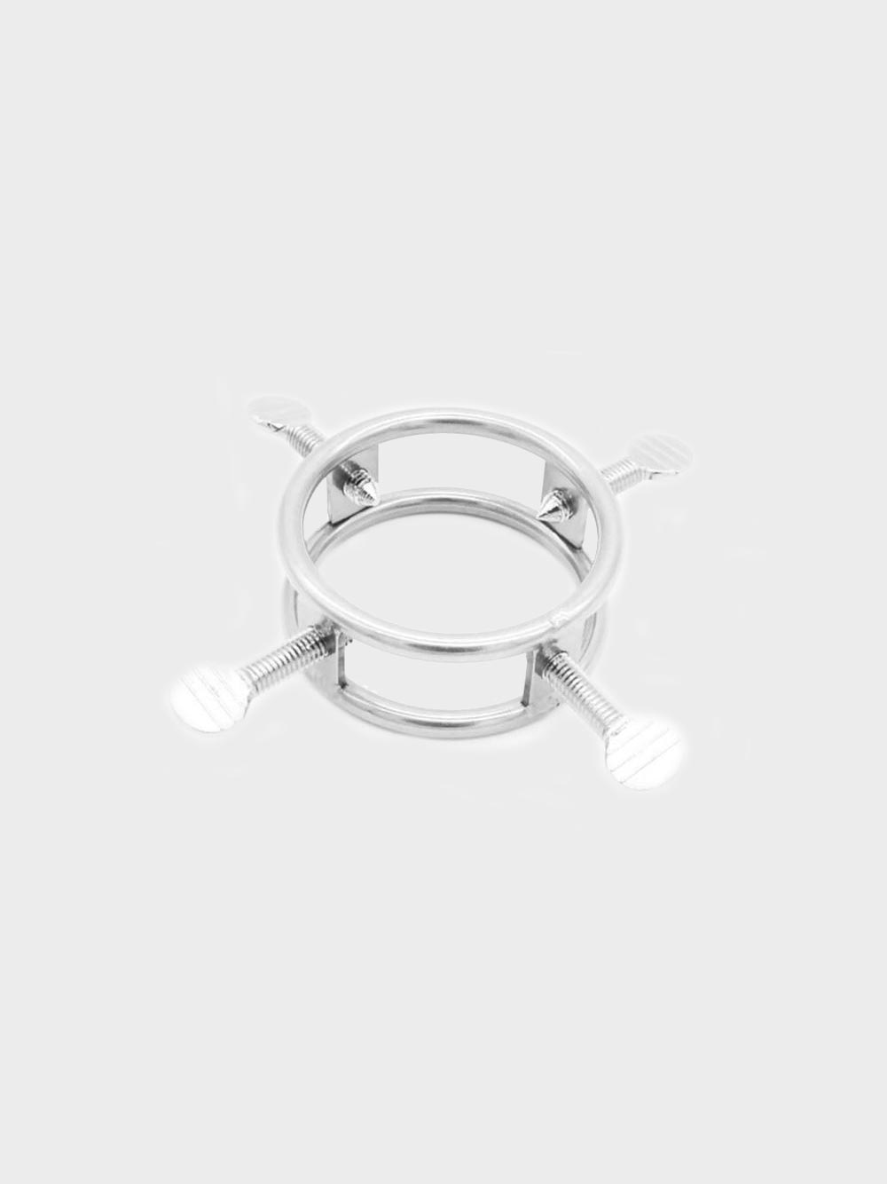 A metal cock cage that has 4 screws to torture the submissive, available at Chastity Cages Co