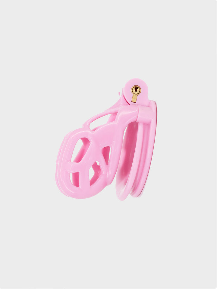 the very small chastity cage known as Cobra Nano, in color pink.