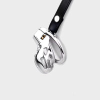 A fully steel chastity cage, on a leather belt