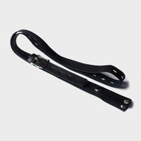 A faux leather belt which attached to male chastity cages