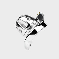 Close up of a silver chastity cage for men.
