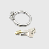 A lock and keys for a male chastity cage.